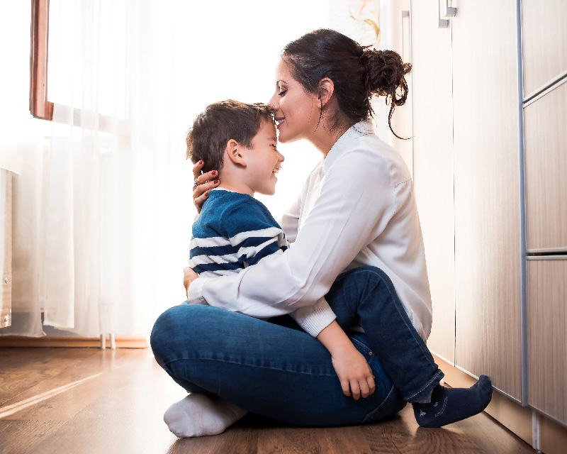 Mother and son in a cuddle; find parenting support in Madison, WI