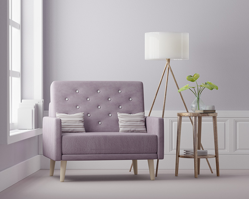 Purple chair and lamp by a window in counseling office