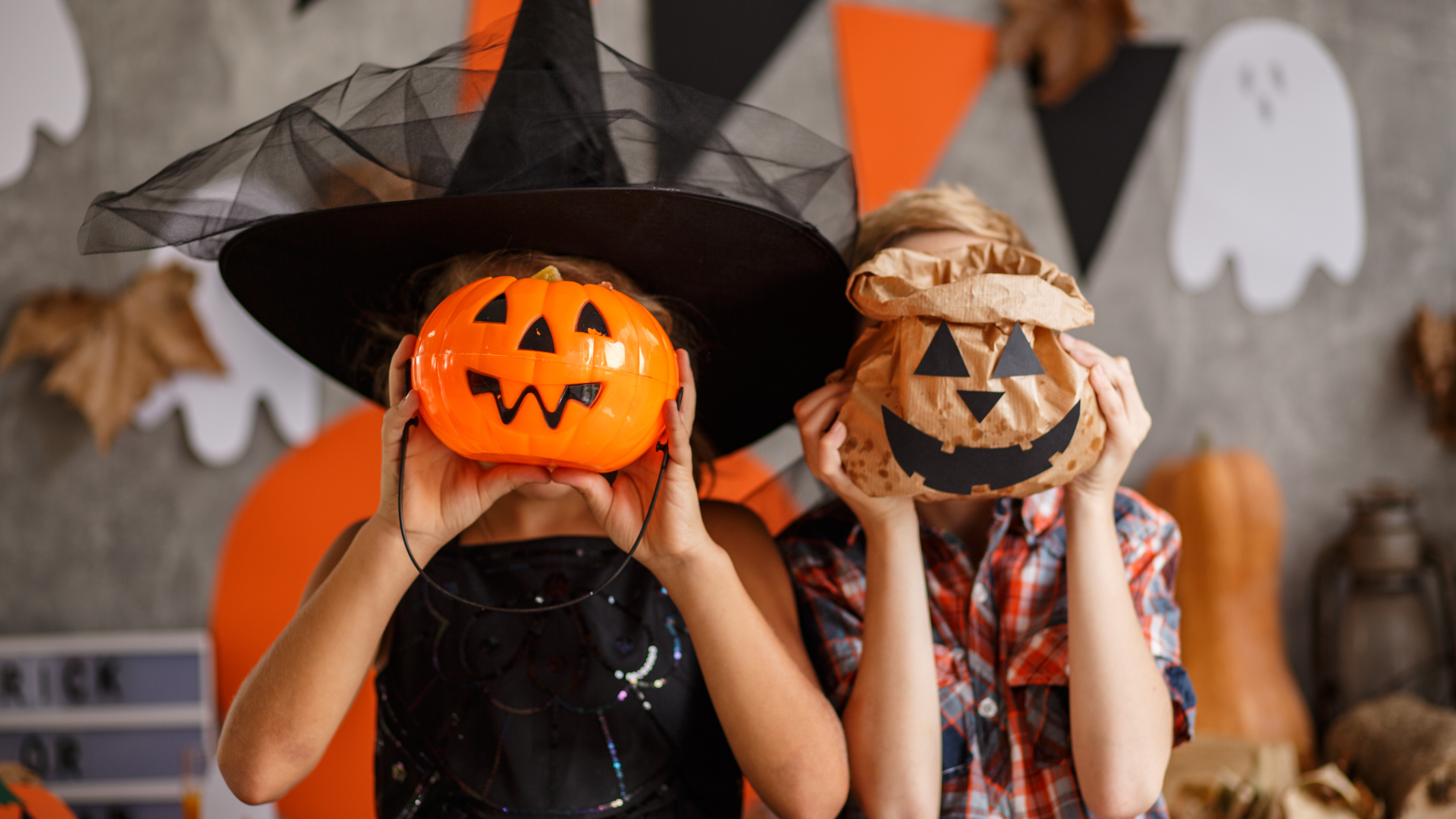 stress counseling Madison WI kids in Halloween costumes holding pumpkin mask