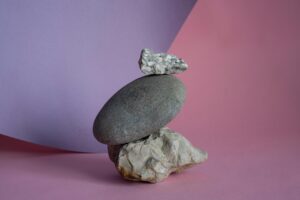 Stacked rocks symbolizing balance and stability in therapy for young adults managing stress in Madison WI