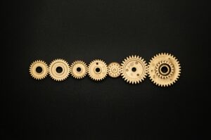 Interlocking gears representing therapeutic connection and the right fit with a stress therapist for young adults Madison WI
