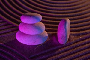 Stacked rocks symbolizing balance and stability in therapy for young adults managing stress in Madison WI