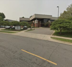 Exterior of the HEART Counseling office building in Madison, WI, showing the entrance and parking area where clients arrive for their first therapy session.