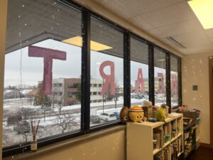 View of the parking lot and office entrance from inside HEART Counseling in Madison, WI, helping new clients know what to expect before their first therapy session.